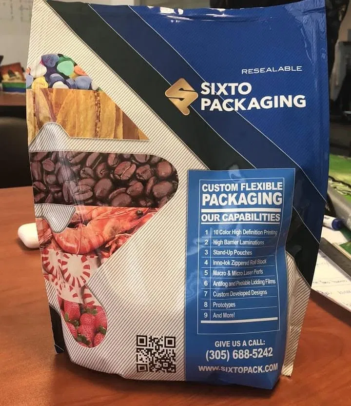 Sixto Packaging resealable sample bag with die-cut windows showing coffee beans, shrimp, candy, and pet supplies alongside a printed capabilities list